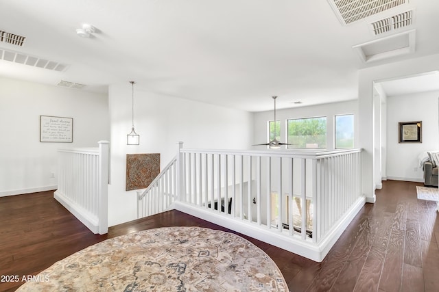 21167 E Aspen Valley Dr, Queen Creek, AZ 85142 - corridor with an upstairs landing, dark wood-style floors, and baseboards