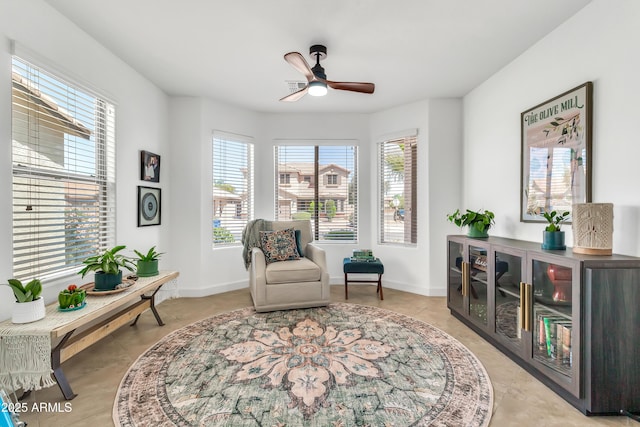 21167 E Aspen Valley Dr, Queen Creek, AZ 85142 - living area with a ceiling fan, light tile patterned flooring, and baseboards