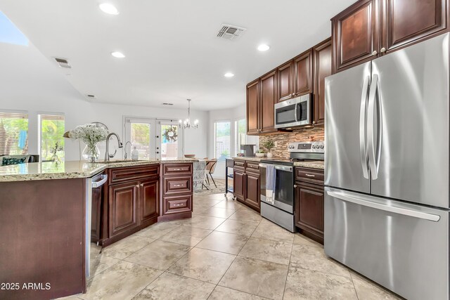 21167 E Aspen Valley Dr, Queen Creek, AZ 85142 - kitchen with appliances with stainless steel finishes, recessed lighting, tasteful backsplash, a chandelier, and a sink