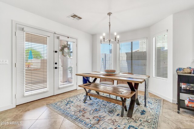 21167 E Aspen Valley Dr, Queen Creek, AZ 85142 - dining area featuring a chandelier, light tile patterned floors, and french doors