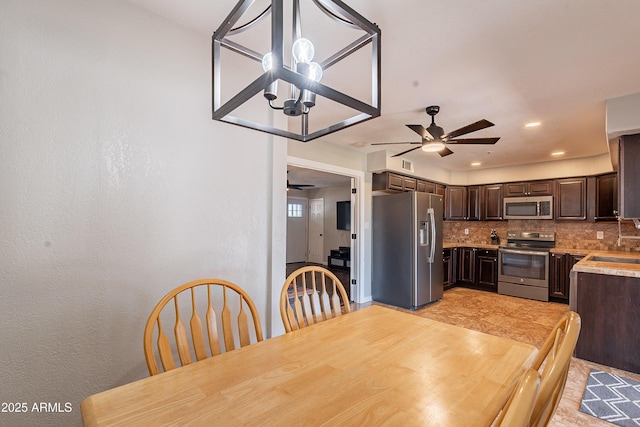 215 S 132nd St, Chandler, AZ 85225 - dining room featuring a ceiling fan, a chandelier, and recessed lighting