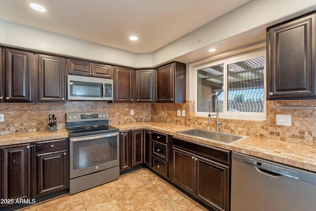 215 S 132nd St, Chandler, AZ 85225 - kitchen with stainless steel appliances, dark brown cabinetry, light countertops, tasteful backsplash, and recessed lighting