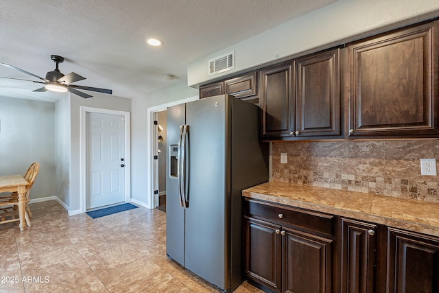 215 S 132nd St, Chandler, AZ 85225 - kitchen featuring stainless steel fridge, decorative backsplash, dark brown cabinets, ceiling fan, and recessed lighting