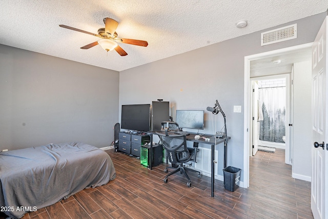 215 S 132nd St, Chandler, AZ 85225 - bedroom with wood finished floors, an office area, a textured ceiling, and ceiling fan