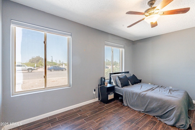 215 S 132nd St, Chandler, AZ 85225 - bedroom with dark wood-style flooring, ceiling fan, and a textured ceiling