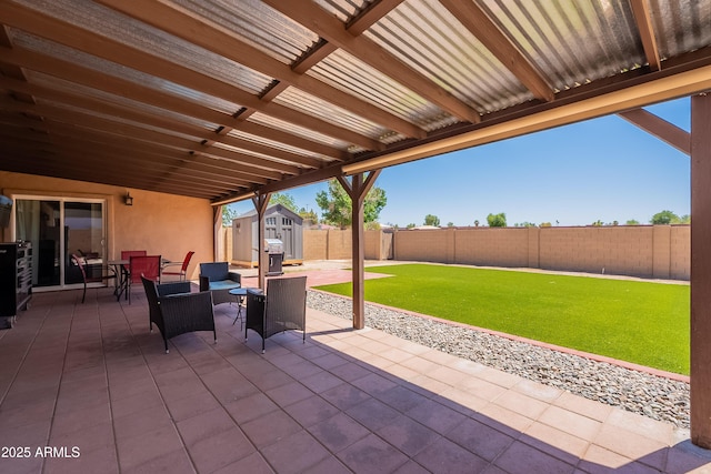 215 S 132nd St, Chandler, AZ 85225 - fenced backyard with a storage unit, a patio, outdoor dining area, and area for grilling