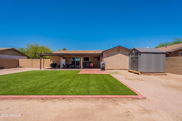 215 S 132nd St, Chandler, AZ 85225 - back of property featuring a patio area, a shed, and a fenced backyard