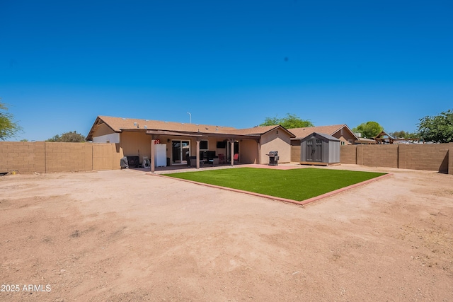 215 S 132nd St, Chandler, AZ 85225 - back of house with a storage shed, a fenced backyard, and a patio