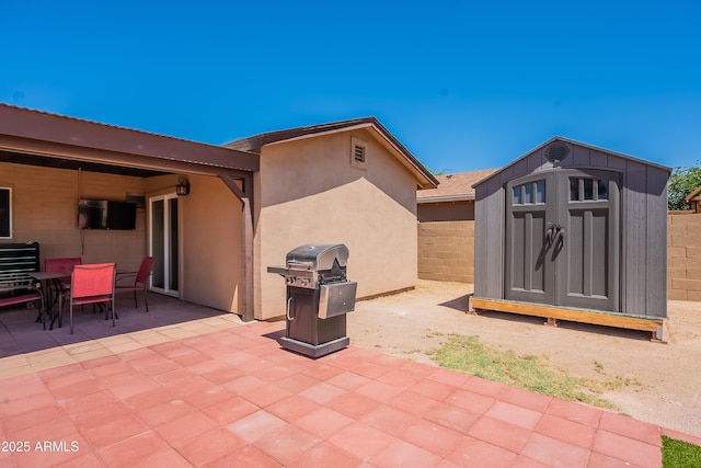 215 S 132nd St, Chandler, AZ 85225 - view of patio / terrace featuring a storage shed, area for grilling, and outdoor dining space