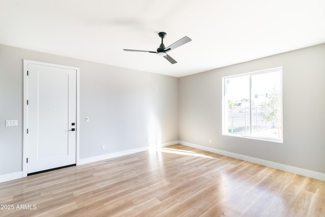 unfurnished room with ceiling fan and light wood-type flooring