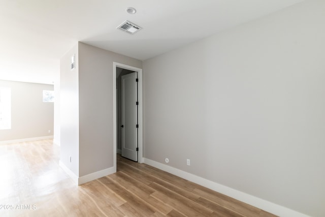 unfurnished room with light hardwood / wood-style flooring