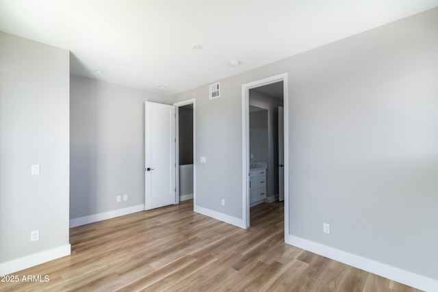 unfurnished bedroom with light hardwood / wood-style floors