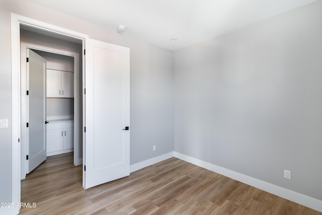 unfurnished bedroom featuring light hardwood / wood-style flooring