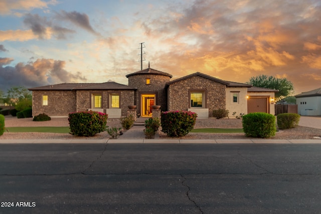 prairie-style house featuring a garage