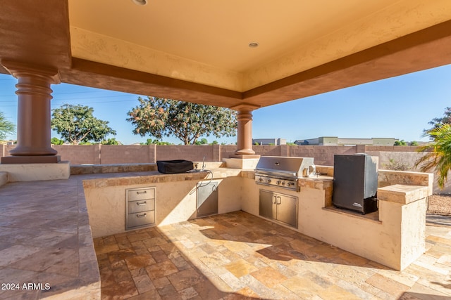 view of patio / terrace with exterior kitchen and grilling area