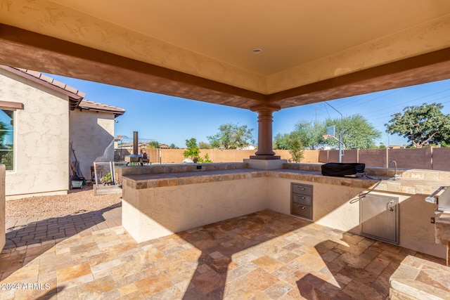 view of patio / terrace featuring exterior kitchen