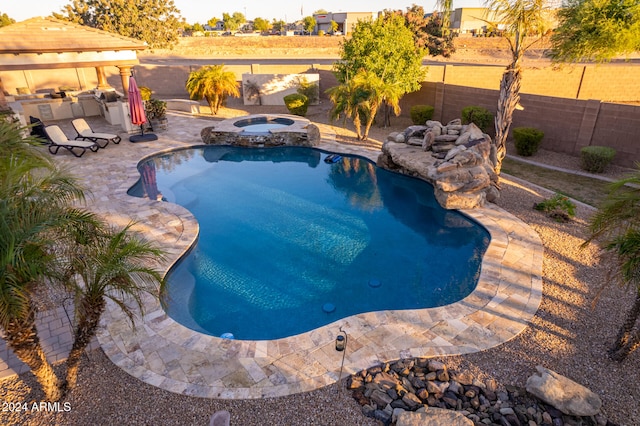 view of swimming pool with a patio, a gazebo, and an in ground hot tub