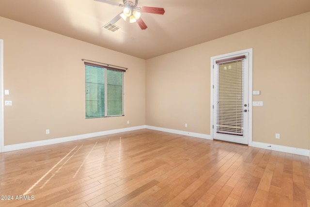 spare room featuring ceiling fan and light wood-type flooring