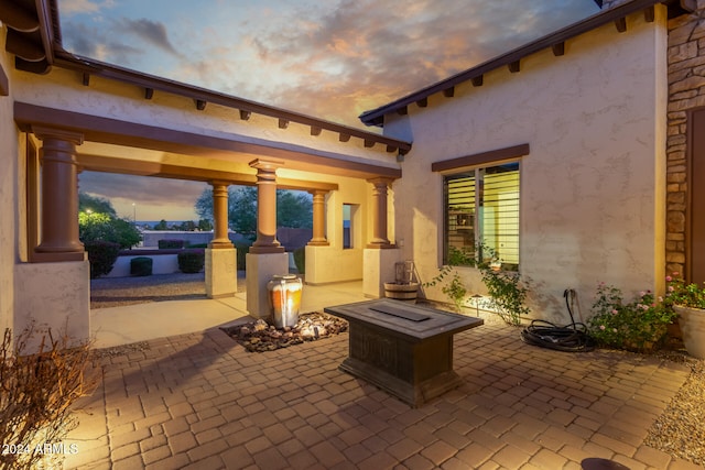 patio terrace at dusk with a fire pit