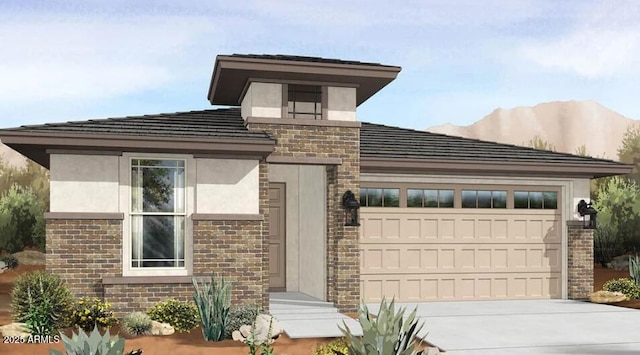 view of front of property featuring an attached garage, stucco siding, a tile roof, brick siding, and driveway