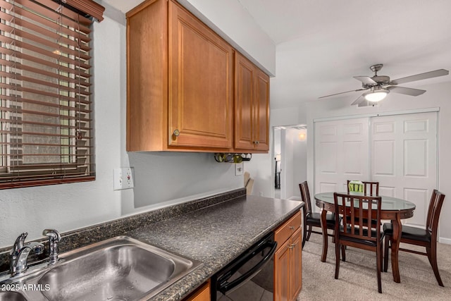 kitchen featuring dishwasher, sink, and ceiling fan