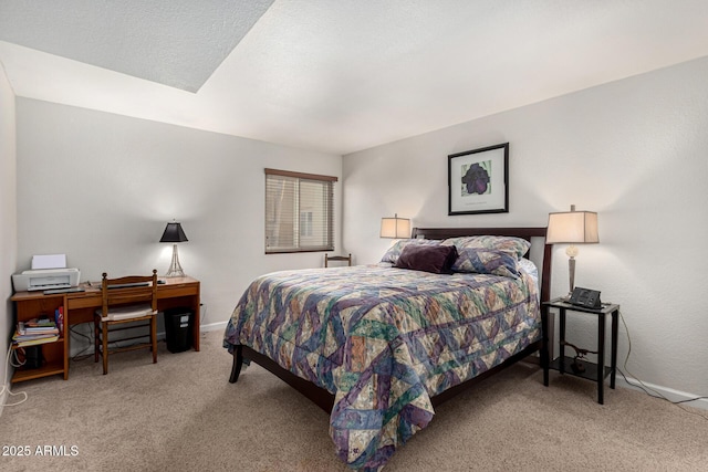 carpeted bedroom featuring a textured ceiling