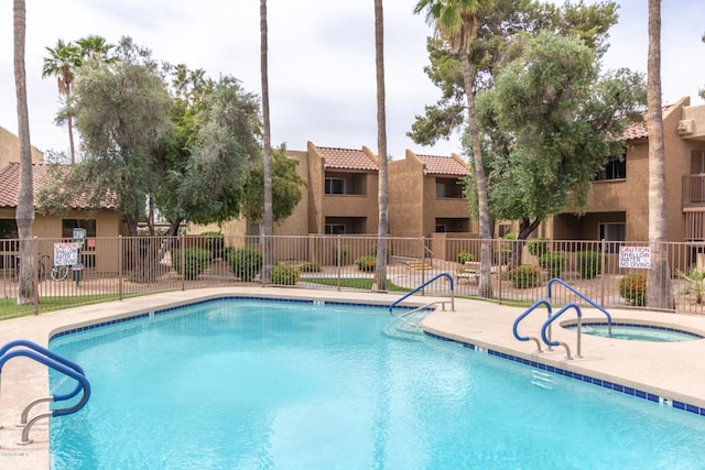 view of pool featuring a hot tub