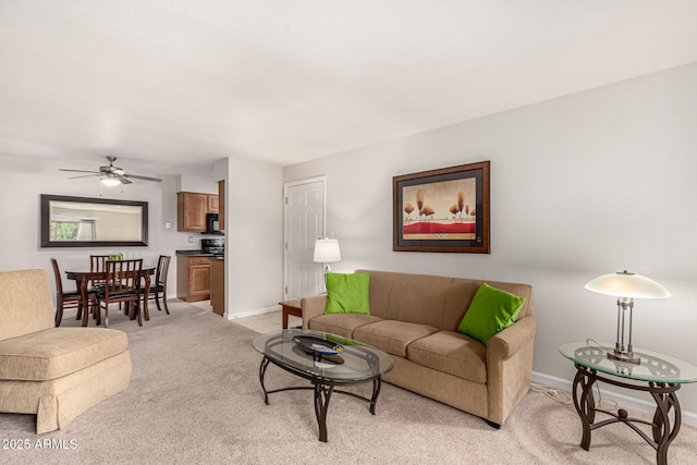 living room with light colored carpet and ceiling fan