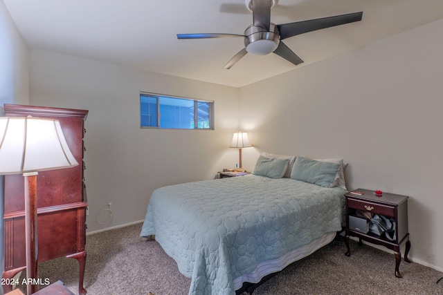 carpeted bedroom with baseboards and a ceiling fan