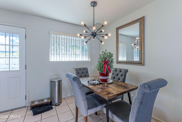 dining room featuring light tile patterned floors, a notable chandelier, and visible vents