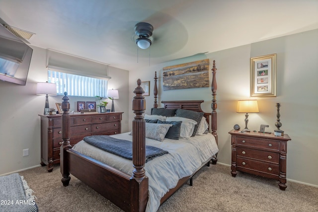 carpeted bedroom with baseboards and ceiling fan