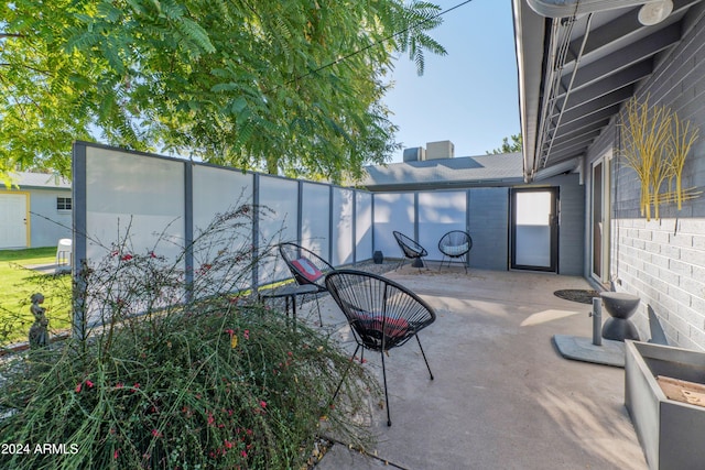 view of patio / terrace featuring fence