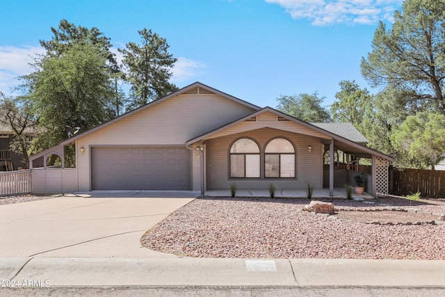 ranch-style home featuring a garage