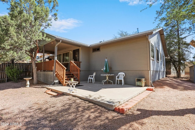 rear view of property featuring a patio area