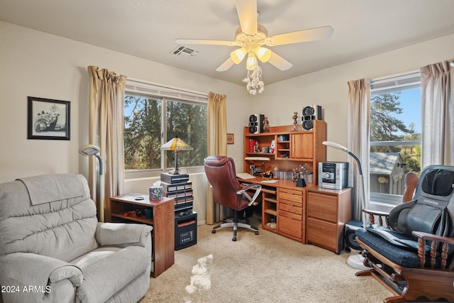 office space with ceiling fan and light carpet