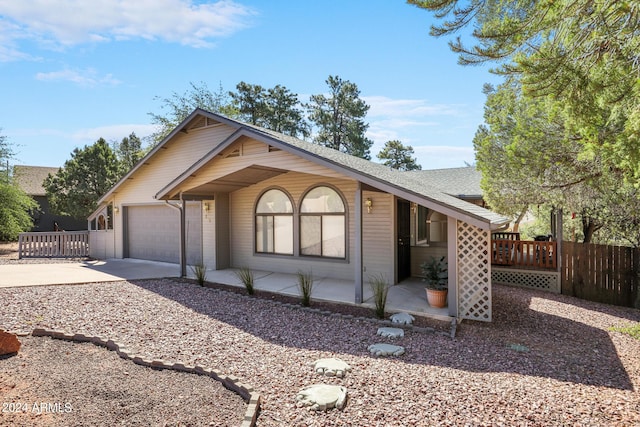 ranch-style home featuring a garage