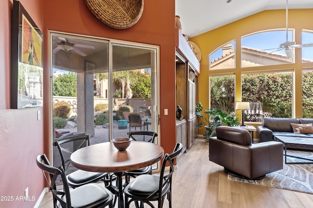 sunroom / solarium featuring ceiling fan and lofted ceiling