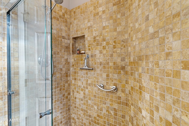 bathroom with a shower with shower door