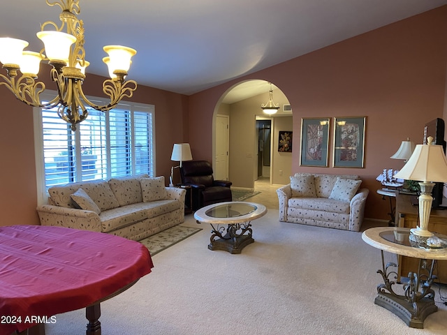 living room featuring a chandelier and carpet floors