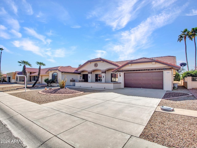 mediterranean / spanish-style house featuring a garage