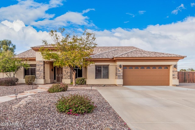 prairie-style home featuring a garage