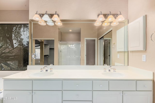 bathroom with an enclosed shower and vanity