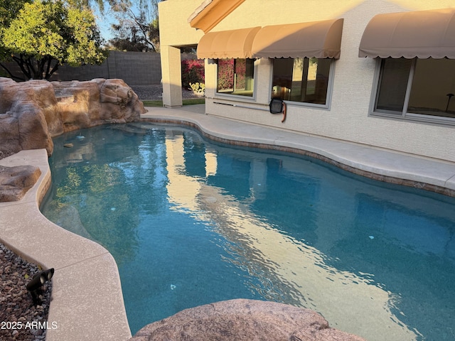 view of swimming pool featuring a patio