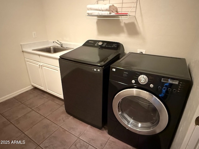 laundry room with cabinets, independent washer and dryer, tile patterned floors, and sink