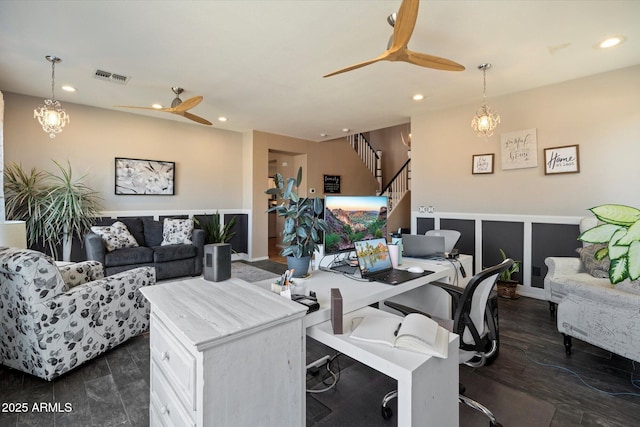 living room with visible vents, recessed lighting, and ceiling fan with notable chandelier
