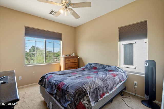 bedroom with carpet, visible vents, baseboards, and ceiling fan