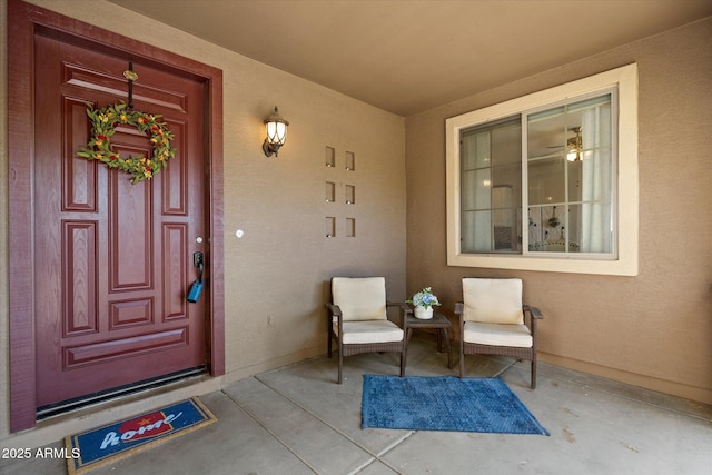 entrance to property with stucco siding