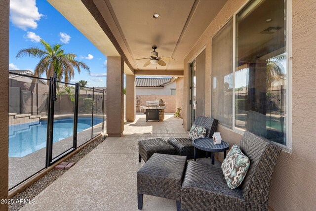 view of patio / terrace with a fenced in pool, a fenced backyard, and ceiling fan