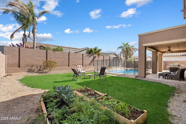 view of yard featuring a fenced in pool, a garden, a patio area, a fenced backyard, and ceiling fan