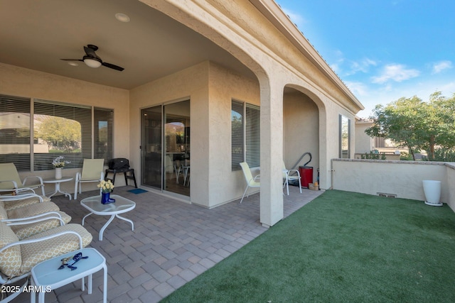 view of patio / terrace featuring ceiling fan